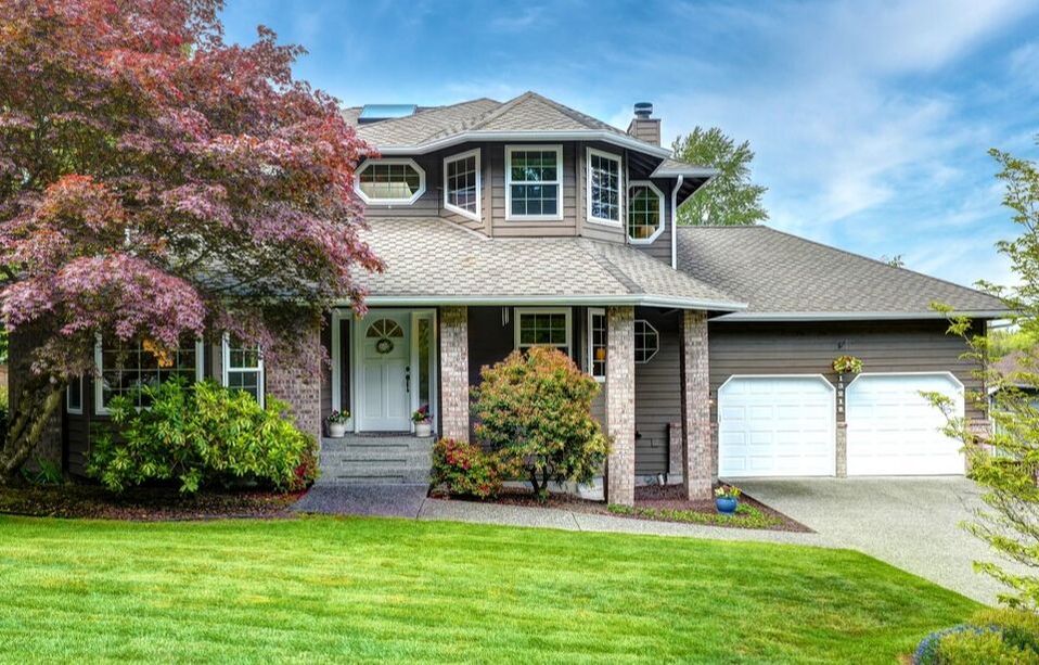 Luxurious home with may windows has classical presence in the community.